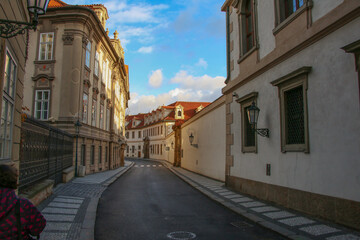 Naklejka na ściany i meble A winding street in the old historical part of Prague. Czech Republic