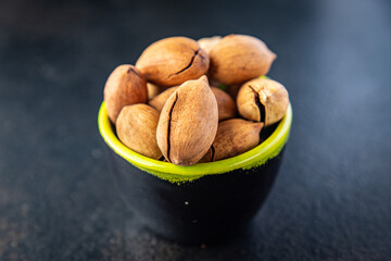pecan fresh nut in shell snack on the table copy space food background rustic. top view vegan or vegetarian food
