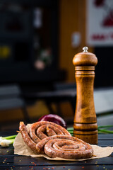 Assorted grilled sausages on rustic wood