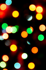 blurred defocused christmas lights bokeh on a black background