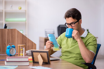 Young male designer working in the office