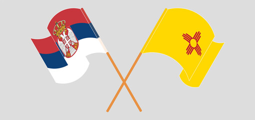 Crossed and waving flags of Serbia and the State of New Mexico