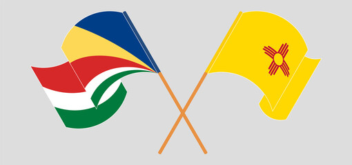 Crossed and waving flags of Seychelles and the State of New Mexico