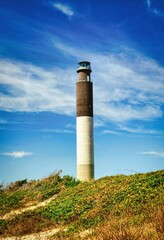 The Oak Island lighthouse view on the coast at Oak Island in North Carolina. © Mark Alan Howard