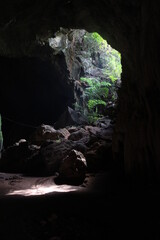 Interior of a cave lit by sunlight.