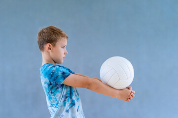 School kid playing volleyball in a physical education lesson. Horizontal education poster, greeting...