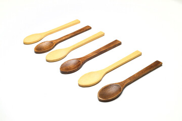 Wooden spoon on a white background. Wooden dishes. Isolate on a white background.