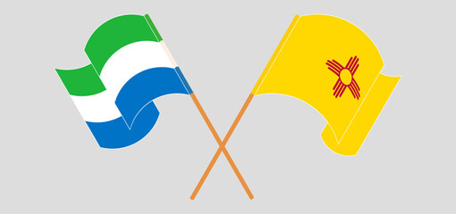Crossed and waving flags of Sierra Leone and the State of New Mexico