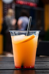 Orange Juice in take away cup with straw
