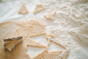 cooking Christmas cookies, flour is scattered on the table