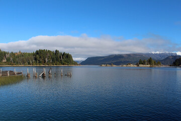 View of Isla Victoria, abandoned dock in the distance, and mountains.