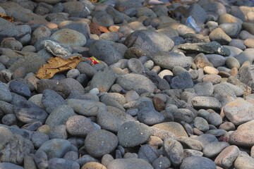 Stacked Beach stones and pebble texture for industrial background