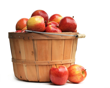 Apples in a Wooden Basket on white