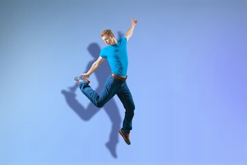 Fototapeta na wymiar Full length body of attractive funny cheerful guy jumping having fun