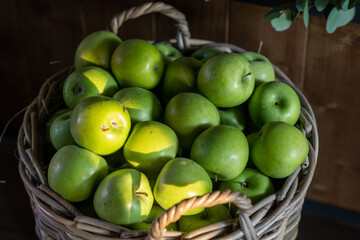 Naklejka na ściany i meble green apples in a basket