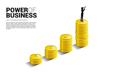 Silhouette of businessman looking through telescope standing on top of growth graph with stack of coin. Concept of success investment and growth in business.