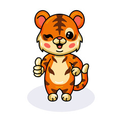 Cute baby tiger cartoon giving thumb up