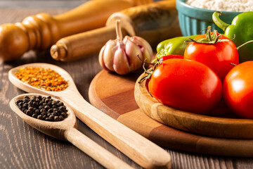 Wooden table with ingredients for pizza.