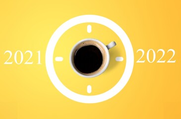 Happy new year 2022. Cup of coffee change 2021 to 2022 on the background. Start concept