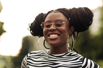 Young african american woman with curly hair, black woman in the city