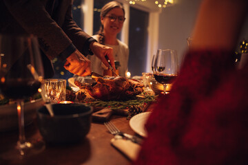 Family having Christmas dinner at home