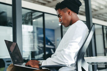 Creative businessman working on a new code in a modern office