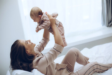 Woman with a baby. Beautiful mother with a baby. High quality photo - 459594070