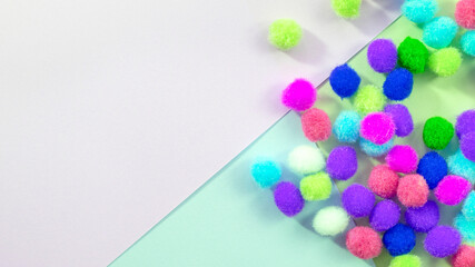 Abstract pastel colored paper texture background with multicolored confetti.