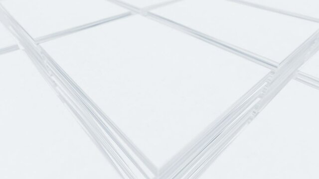 Bundle of sheets of white paper. White desk in office. Business and education concept. Loop animation.