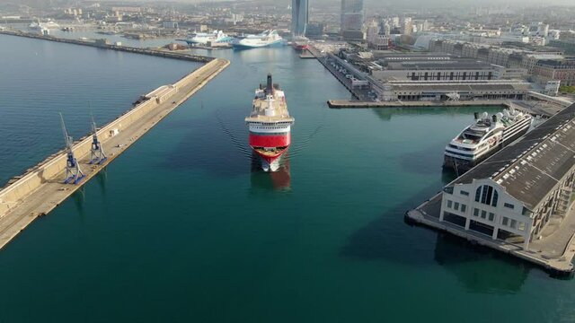 Aerial view of a cruise liner, sunny morning, in Marseille, France - tilt, drone shot