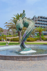 Naklejka premium Spain, Maspalomas, 12.09.2021: Serpent fountain sculpture in Maspalomas. 