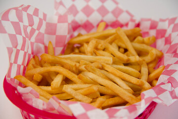 Crispy french fries inside a basket