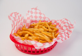 Crispy french fries inside a basket