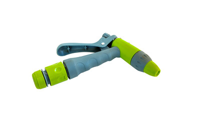 watering hose spray gun for watering plants in a gardenon, green gun spray water on white,