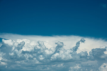 Beautiful blue sky with amazing white clouds. Nature background. Place for text.