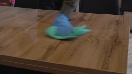 Disinfect and Sanitize the table and the surface - COVID 19. Cleaning and disinfection of homes and public places. Hygiene and sanitation. An alcohol-based antibacterial solution and microfibre cloth