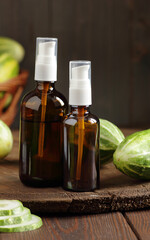 Cucumber seed oil or juice, amber glass bottle with natural extract, closeup, natural medicine and naturopathy concept
