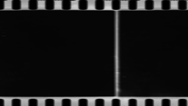 film strip with film. Film noise or grain seamless texture. Retro template. Opacity or screen mode usage for overlay your video. Negative film. Scratched strip. Old fashion tape looped animation in 4K