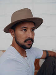 Latinx man with hat