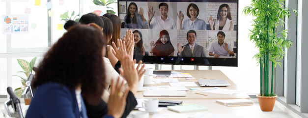 Close up shot of multicultural businessman businesswoman colleagues on teleconference on monitor...