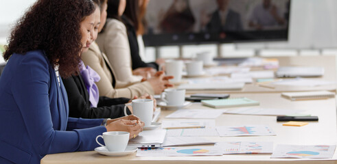 Asian middle aged female successful businesswoman officer staff in formal business clothing sitting...