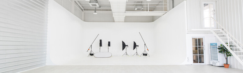 Empty clean nobody in photography studio workshop room full of professional photographer equipment...