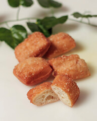 Fried bread to start your morning breakfast. Fried bread has a sweet and savory taste. Pairs well with a cup of hot tea. This bread can be found on the side of the road. Fried Mockup. Focus blur.