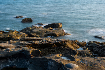 The rocks by the sea and the blue water