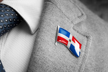 Metal badge with the flag of Dominicana on a suit lapel
