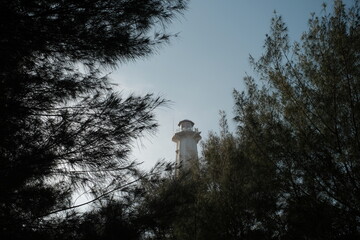 the view of the lighthouse in the evening at pandansari beach, Bantul, Yogyakarta