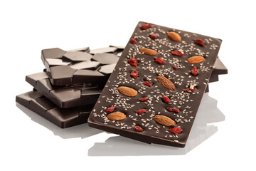 Dark raw chocolate with almonds and goji berries on a white background.