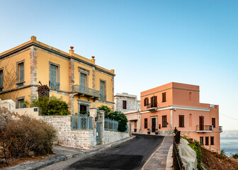 Fototapeta na wymiar Old neoclassical mansions facing the Aegean Sea in the historic Vaporia neighbourhood in Ermoupolis, the capital of Syros Island. Cyclades, Greece.