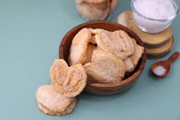 Palmiers cookie. Also known as elephant ear or Pig ear puff pastry cookies. classic French pastry. Sugar French Hearts. Copy space.