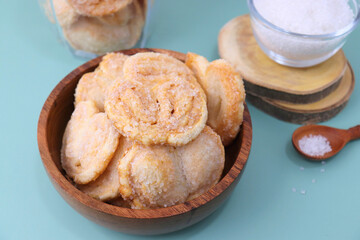 Palmiers cookie. Also known as elephant ear or Pig ear puff pastry cookies. classic French pastry. Sugar French Hearts. Copy space.